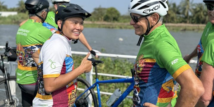 Cyclists Chatting and Smiling